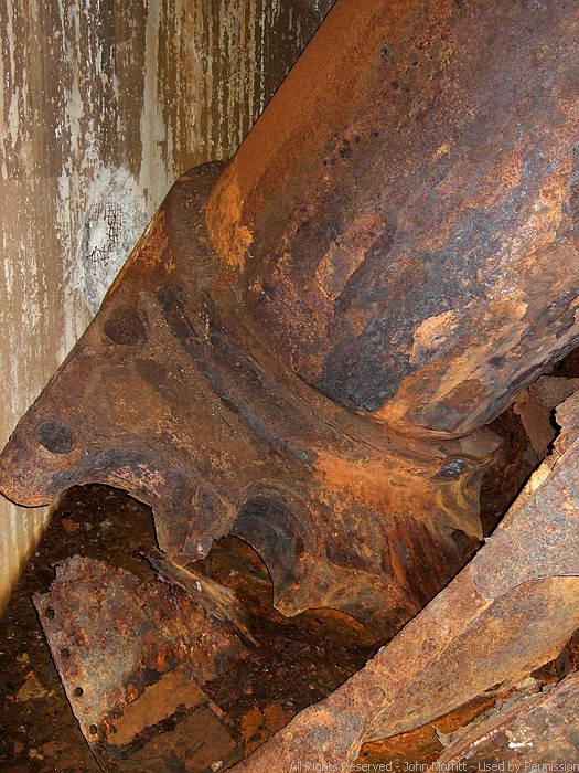 Battery Wilson - The breech of the right side 14 inch gun barrel resting on the turret floor.
